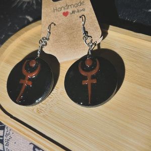 Side view of Hades handmade drop style earrings 