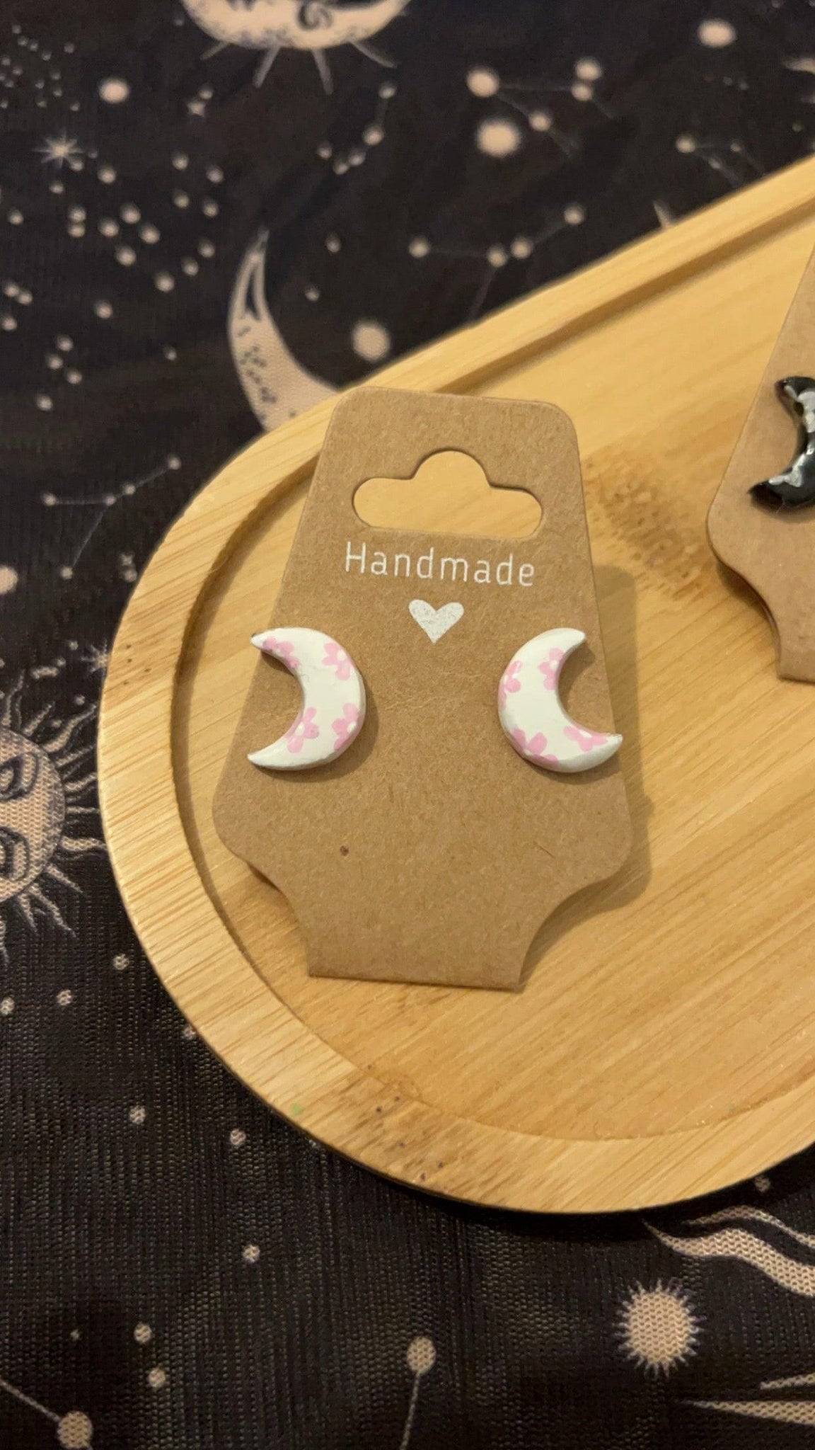 White crescent moons with hand painted pink flowers 